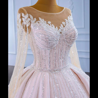 Luxury Beaded Blush Ball Gown Wedding Dress with Long Sleeves